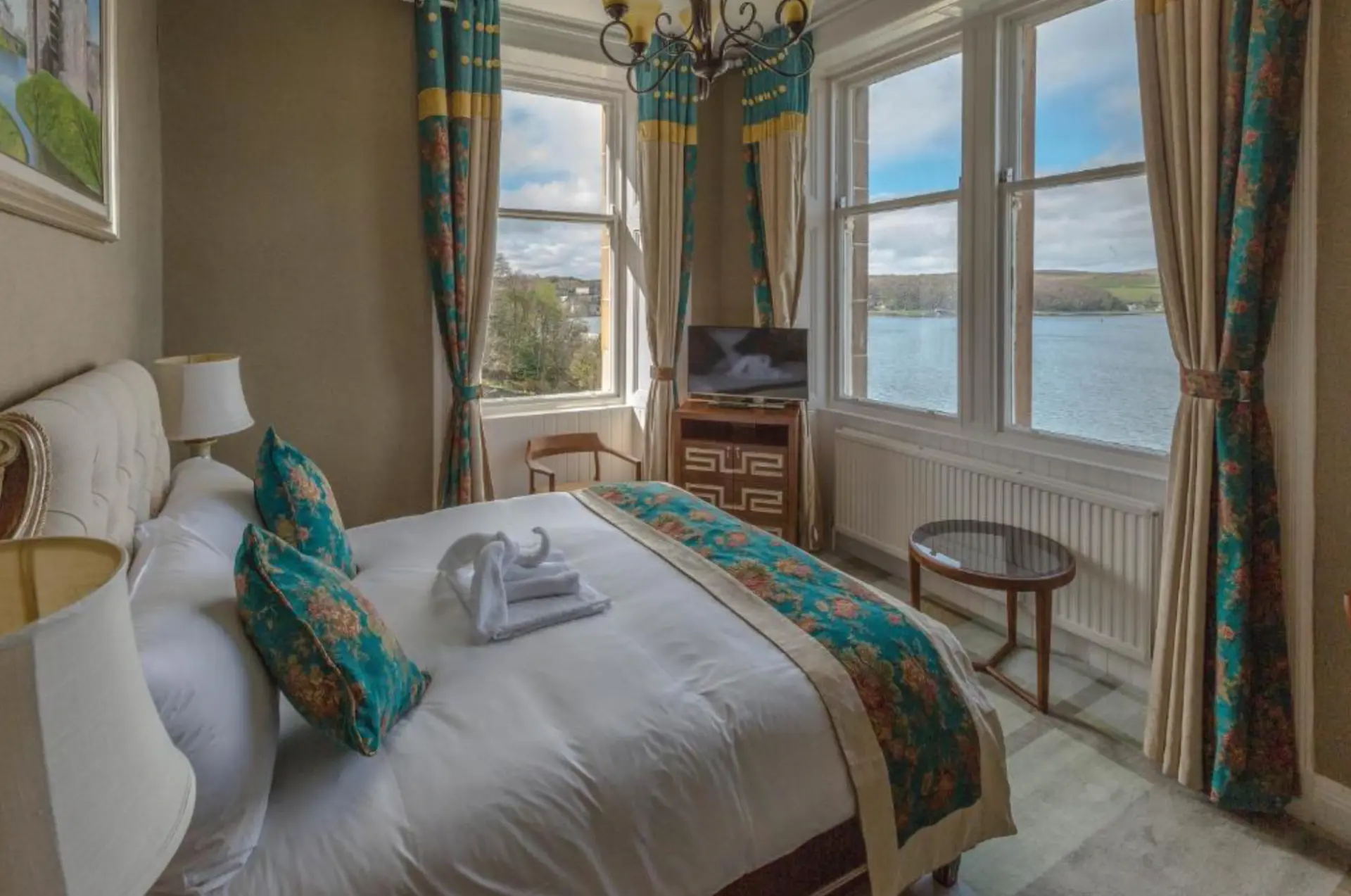 A double room at The Glenburn with bay views through tall windows